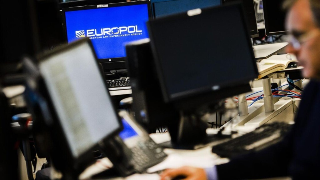 Europol analysts working at computers inside the agency's operations centre